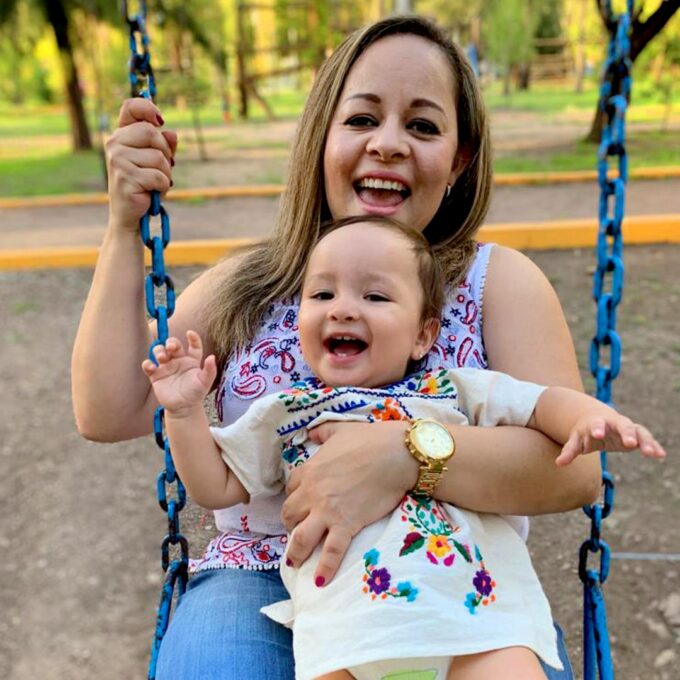 women-dont-give-up-on-motherhood-ivf-mother-with-baby-sitting-on-a-swing