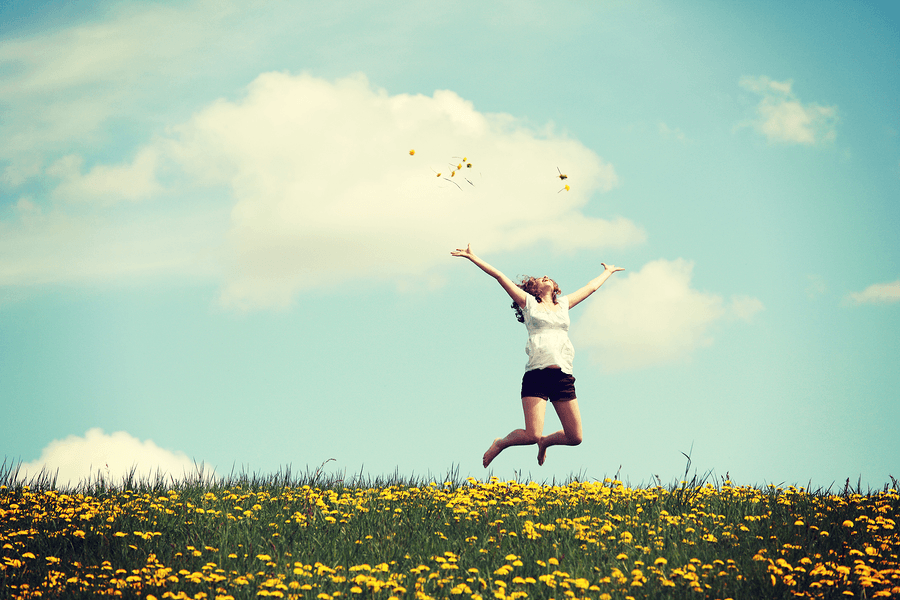 bigstock-Happy-woman-jumping-on-blossom-59295572